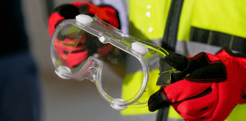 A pair of safety glasses at a construction site