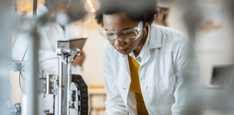 A woman wearing a pair of goggles used at the laboratory