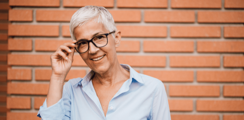 A woman wearing glasses with healthy eyes